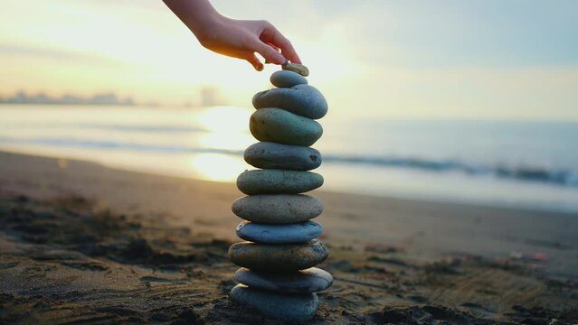 zen pyramid of stones on the ocean beach ,concept idea of balance and harmony lifestyle