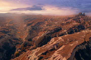 Panoramic view of Goreme national park with over deep canyons, valleys sunset Cappadocia sunset, aerial top view drone