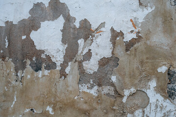 Old wall with worn out limewash plaster