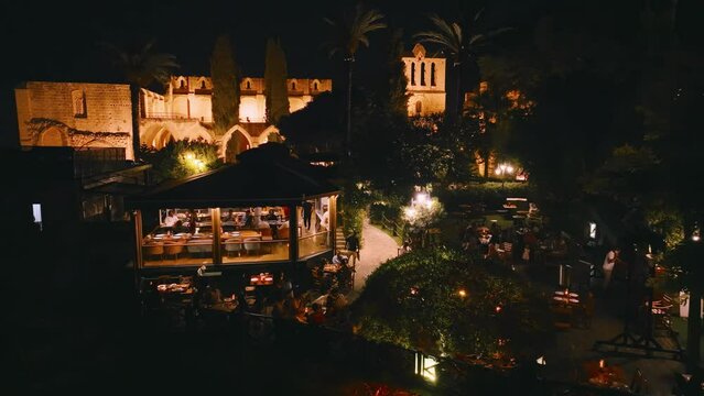 People enjoy dinner at Bellapais Monastery, North Cyprus