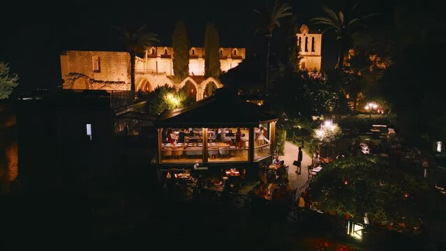 People enjoy dinner at Bellapais Monastery, North Cyprus