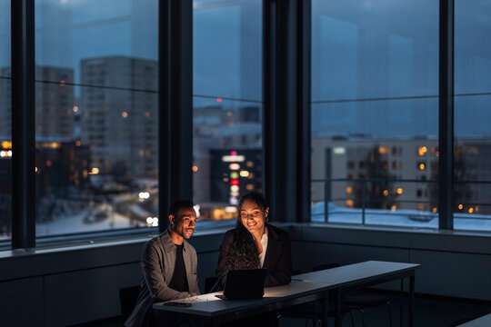 Business people working late in office