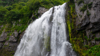 Obraz premium Russia, Kamchatka. A full-flowing mountain waterfall near Tolbachik volcano.