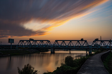 High-speed railway bridge at dusk.