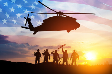 Silhouettes of helicopter and soldiers on background of sunset. Greeting card for Veterans Day, Memorial Day, Air Force Day. USA celebration.