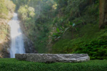 Stone table top podium floor in outdoor waterfall green tropical forest nature background.Natural...