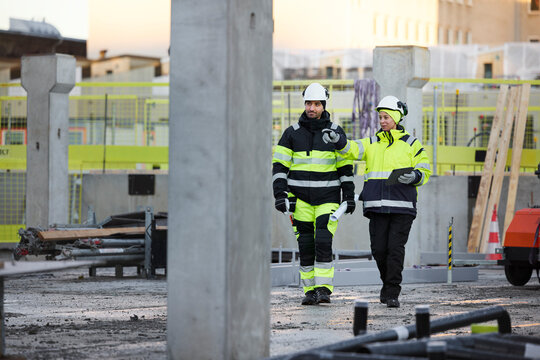 Construction engineers working at construction site
