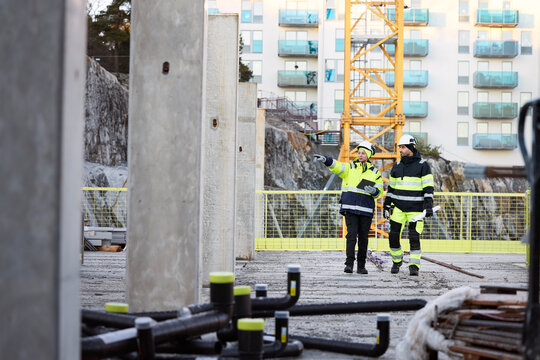 Construction engineers working at construction site