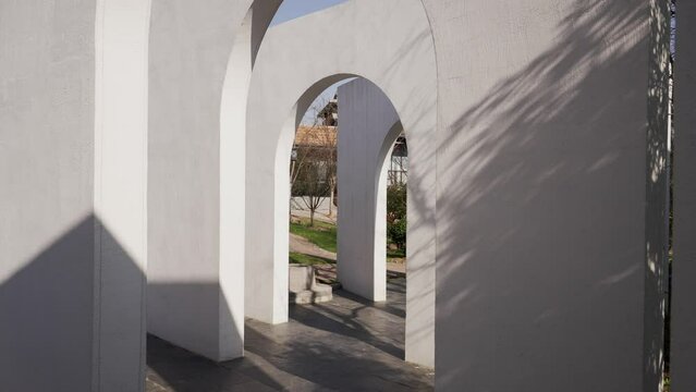 white wall with arch door