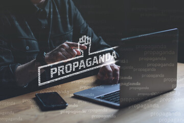 Propaganda visual concept. Man points finger at Propaganda text