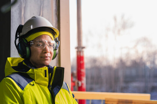 Engineer at building site looking at camera