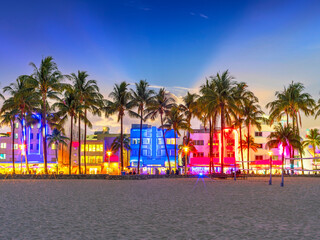 Fototapeta premium Illuminated Ocean Drive Art Deco District at Night .South Beach, Ocean Drive,.Floridas East Coast.Miami Florida USA