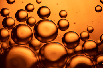 Microbubbles in mixed water and oil background, colorful abstract yellow - green led lights, super-macro abstraction