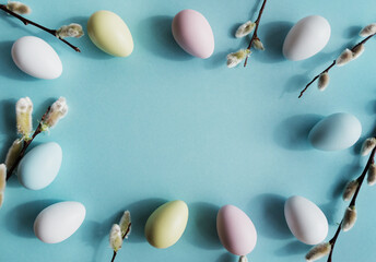 Colourful Easter eggs on a pastel blue background.
