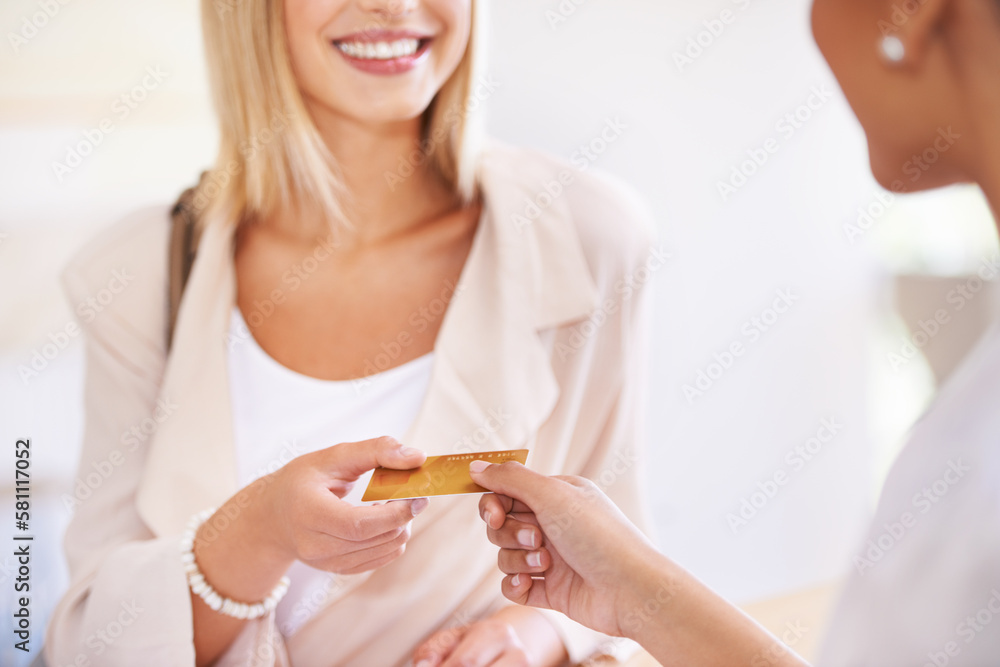 Poster Can I use my debit card. A young woman handing over her credit card to a salesperson.