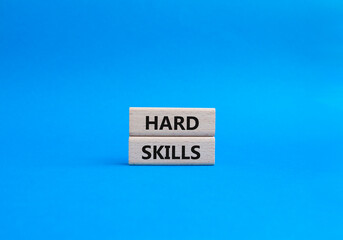 Hard skills symbol. Wooden blocks with words Hard skills. Beautiful blue background. Business and Hard skills concept. Copy space.