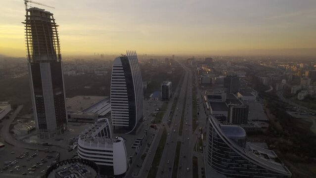 city of Sofia from a new perspective with this stunning aerial shot of a towering office building at sunset