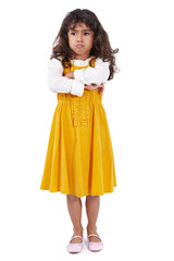 Throwing a tantrum. A little ethnic girl looking unhappy and standing with her arms folded.