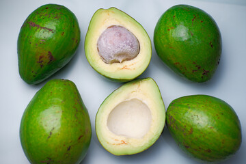 Avocado fruit over wooden background