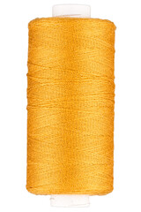 Spool with yellow orange thread for sewing, supply for sewing, isolated object, close-up macro with fine details
