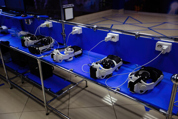 Many virtual reality (VR) sets are charging in VR room