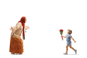 Girl with red roses running towards a muslim woman wearing a hijab