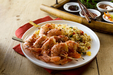 Tasty shrimps scampies with noodles