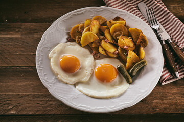 Fried eggs and potatoes for lunch