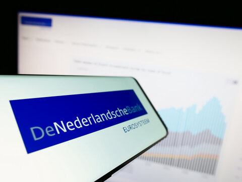 Stuttgart, Germany - 03-09-2023: Smartphone with logo of Dutch central bank De Nederlandsche Bank (DNB) on screen in front of website. Focus on center-left of phone display.