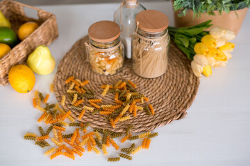 Raw macaroni on wooden kitchen table. Top view