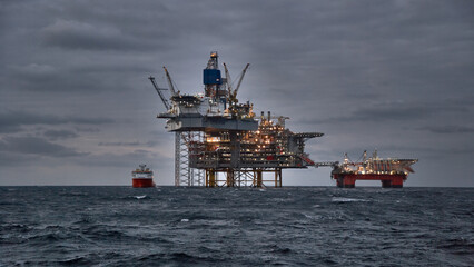 Picture of offshore oil and gas production in the sea in stormy weather at dusk.
Jack up, semi...
