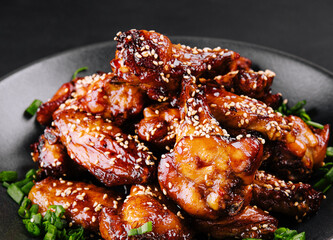 Delicious chicken wings with special marinade and sesame