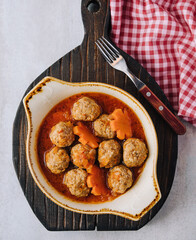 Meatballs in sweet and sour tomato sauce