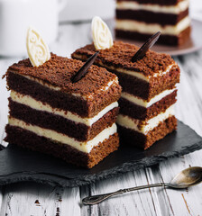 Vanilla and chocolate cake with chocolate slices