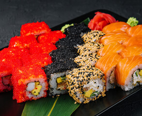 Big set of rolls on black tray