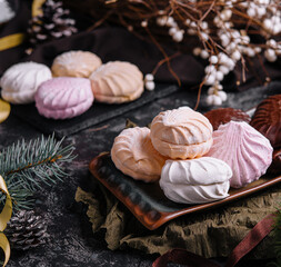 Obraz na płótnie Canvas marshmallow cakes in chocolate glaze and christmas decor