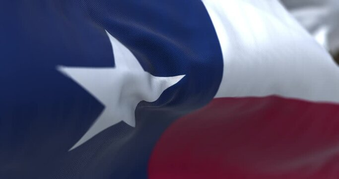 Seamless loop in slow motion of Texas state flag fluttering in the wind