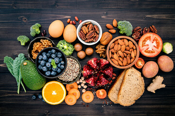 Ingredients for the healthy foods selection. The concept of healthy food set up on wooden background. - obrazy, fototapety, plakaty