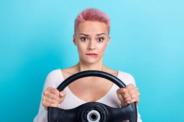 Portrait photo of youngster driver beautiful lady hold her steering wheel nervous learning courses automobile isolated on cyan color background - obrazy, fototapety, plakaty