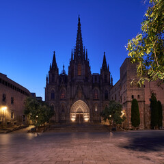 Fototapeta na wymiar Dark cathedral on main square in the evening in Barcelona, Spain