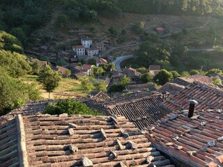 a view from a very high point looking down at houses and roofs