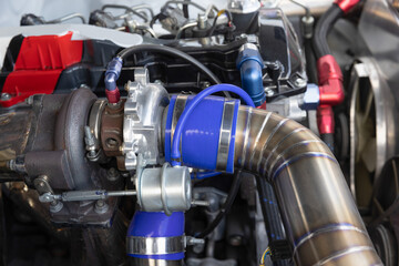 Fototapeta na wymiar Turbo charger on race car engine.