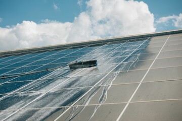 Close-up shot of solar system panel cleaning process