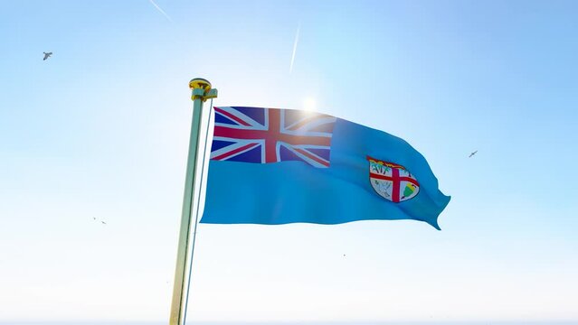 Flag of Fiji waving in the wind, sky and sun background. Fiji Flag Video. Realistic Animation, 4K UHD. 