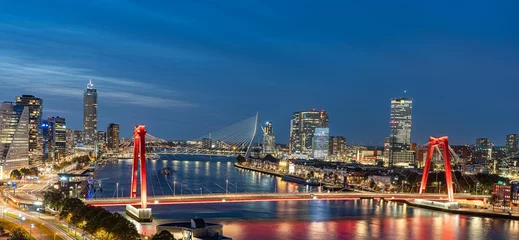 Papier Peint photo Pont Érasme Skyline of Rotterdam at night over the river Maas showing the Willems bridge and the Erasmus bridge