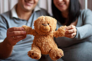 Waiting for a child, pregnancy, parents, childbirth, happy parents, baby teddy bear  