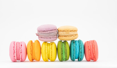 colorful macaroons on wooden background