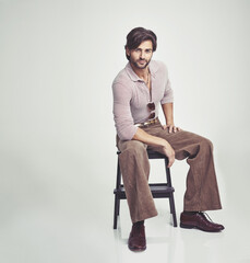70s fashion. A young man dressed in 70s style clothing - isolated.