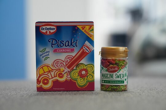 Selective focus of the "Dr. Oetker" sugar pens box and a jar of "Delecta" Christmas candies