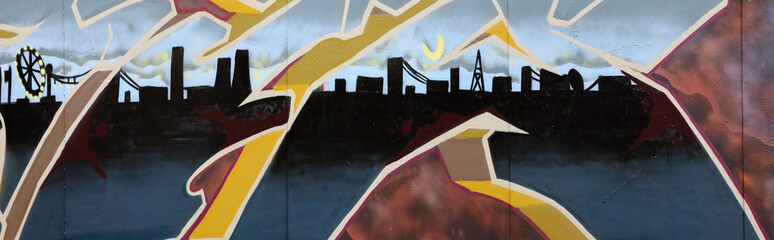 Colorful background of graffiti painting artwork with bright aerosol strips on metal wall. Old...